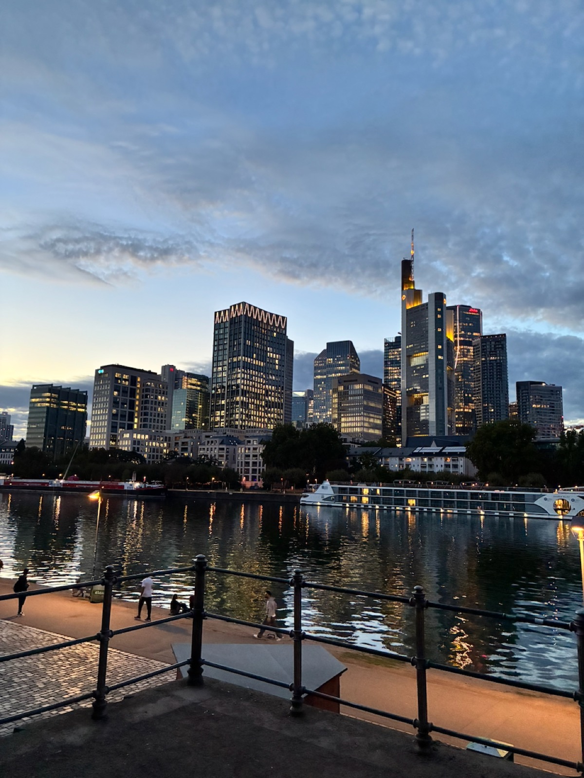 The Frankfurt skyline reflected on the river at dusk